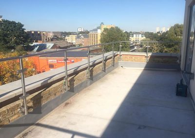 Glass balustrade with post and handrail in London