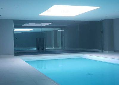 Glass partition for swimming pool area