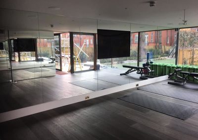 Fitness studio glass wall mirrors