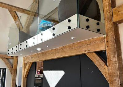 Frameless Glass balustrade on mezzasine level in Wallington