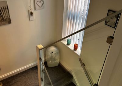 Aldershot home with glass infill panels on landing and staircase