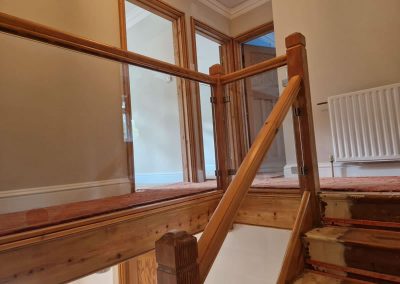 Glass infill panels on landing and staircase in Slough