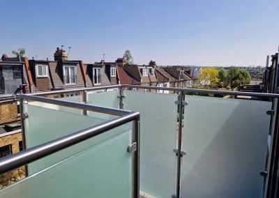 Post and handrail glass balustrade in West London