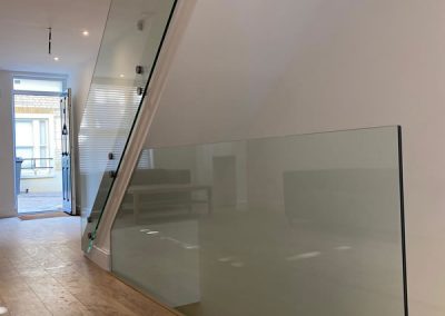 Staircase and landing with glass balustrade