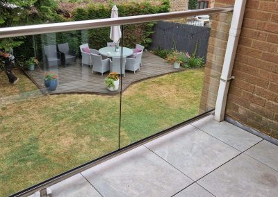 Glass balcony with rail in Towcester